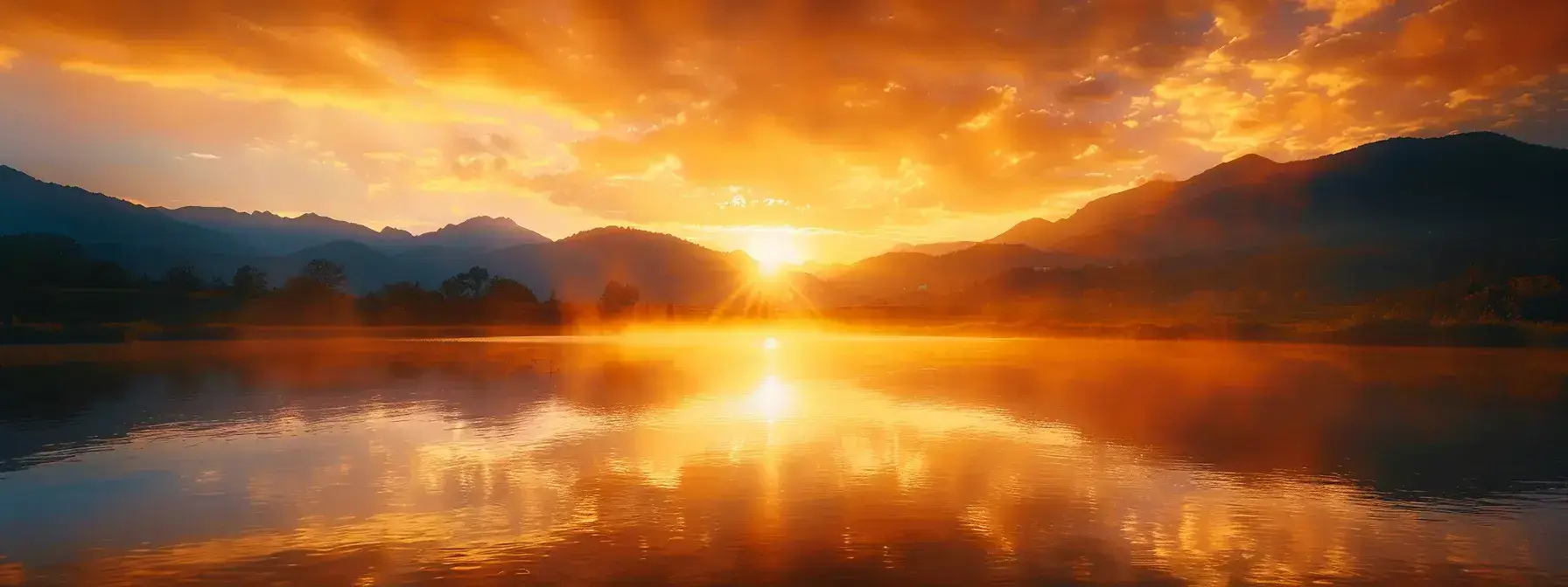 a majestic sunrise casts golden rays over a serene mountain lake, reflecting the vibrant colors of the sky and the rugged peaks, creating a tranquil and breathtaking landscape.