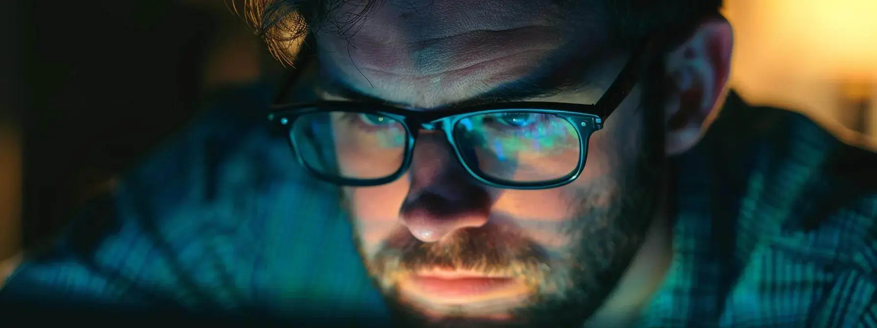a focused man analyzing keyphrase rankings on his wordpress dashboard. a focused man analyzing keyphrase rankings on his wordpress dashboard.