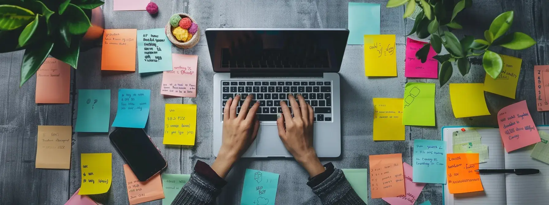 a person typing on a laptop surrounded by sticky notes filled with long-tail and question-based keywords, highlighting the focus on voice search optimization. a person typing on a laptop surrounded by sticky notes filled with long-tail and question-based keywords, highlighting the focus on voice search optimization.