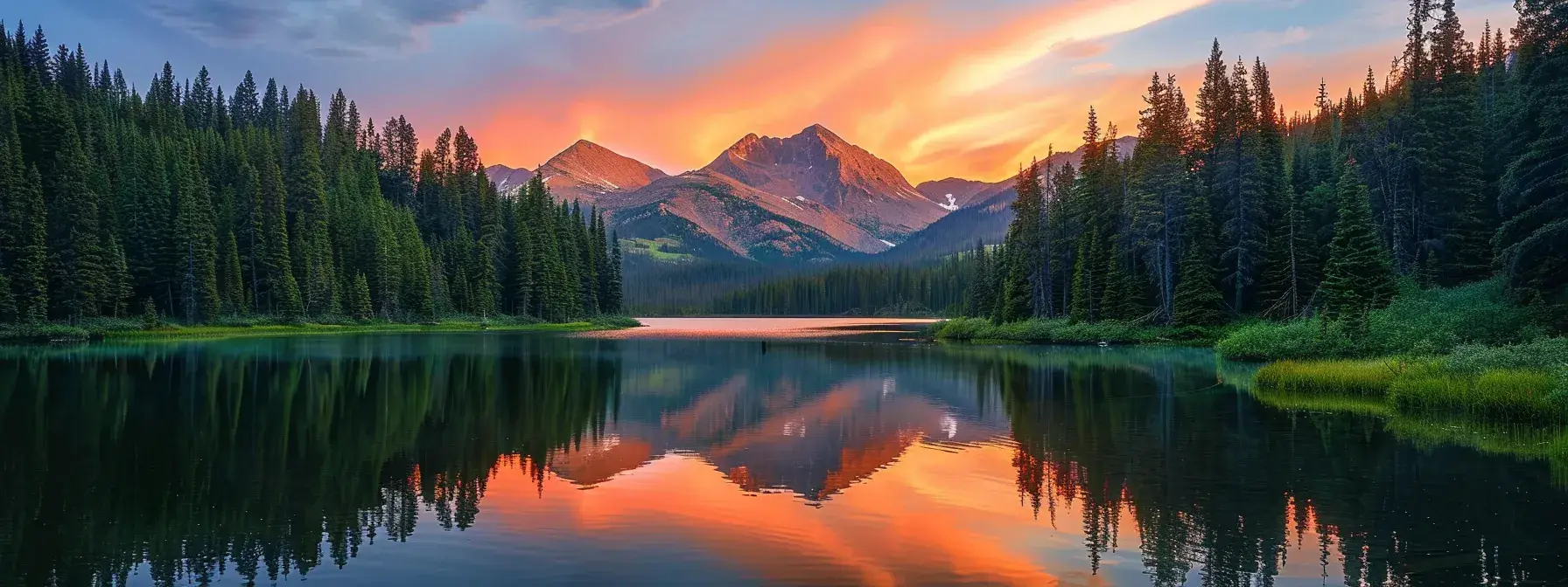 a breathtaking sunrise illuminates a tranquil mountain lake, surrounded by lush evergreen trees, reflecting vibrant hues of orange and pink across the serene water surface.
