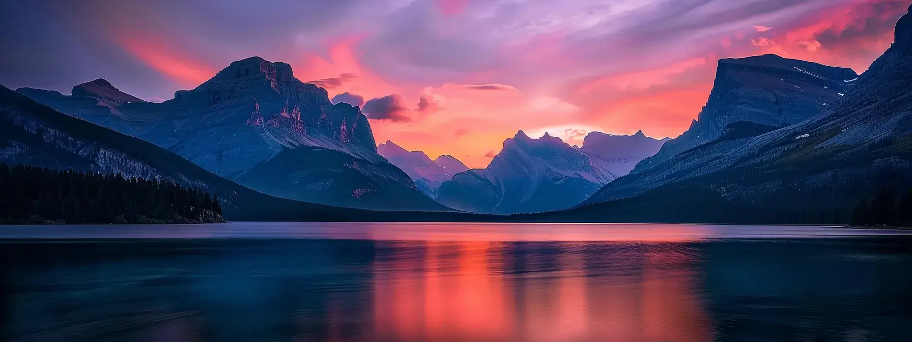 a breathtaking sunset casts vibrant hues of orange and pink across the calm waters of a secluded lake, framed by majestic mountains silhouetted against the evening sky.