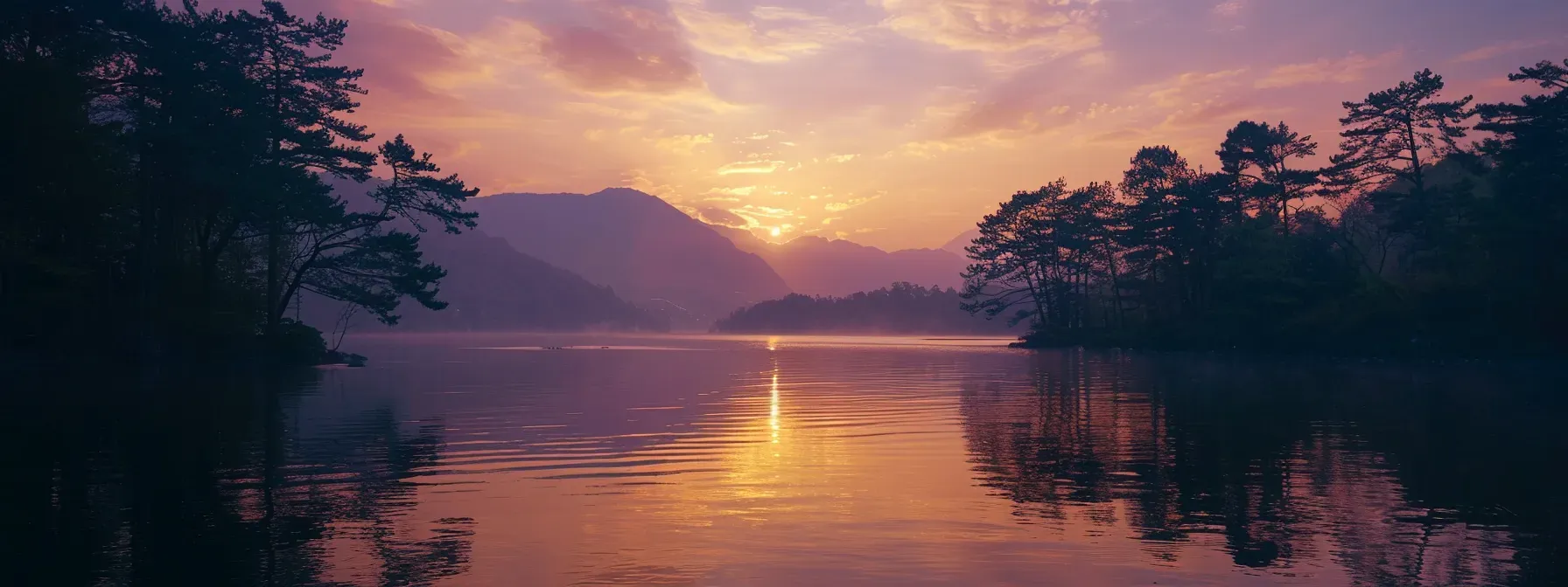 a breathtaking sunset over a tranquil lake, with vibrant orange and purple hues reflecting off the water’s surface, framed by silhouette trees along the shoreline.